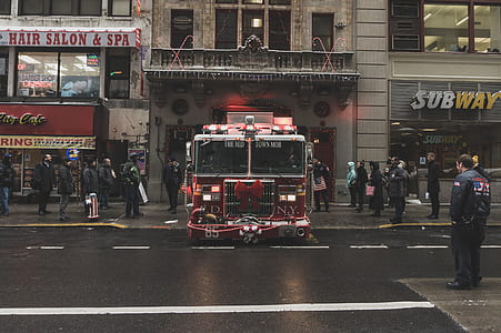 people standing near parked fire truck thumbnail