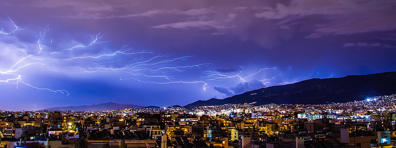 high-angle photograph of city under lightning thumbnail