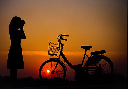 silhouette of woman and bicycle on thumbnail