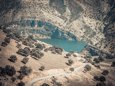 aerial view of lake within mountain thumbnail