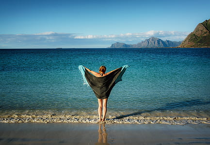 woman holding black sheer shawl thumbnail