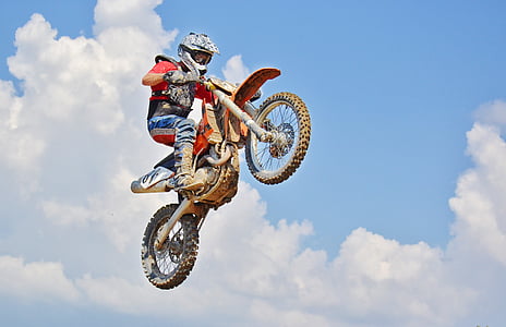 man riding motocross dirt bike thumbnail