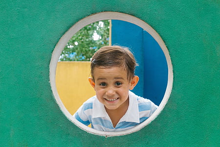 boy in hole on playset thumbnail