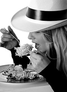 grayscale photography of woman eating pasta thumbnail
