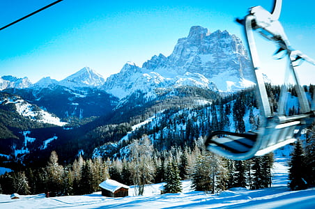 ski lift near brown house at daytime thumbnail