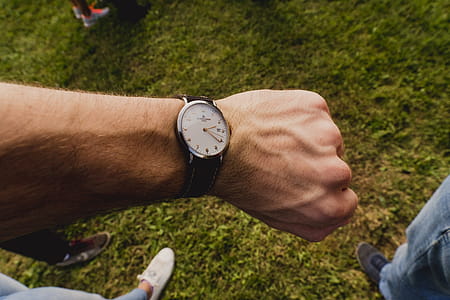 Person Wearing White and Black Watch thumbnail