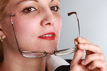 woman in black and white collared top wearing eyeglasses thumbnail