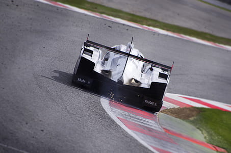 white Formula 1 on track during daytime thumbnail