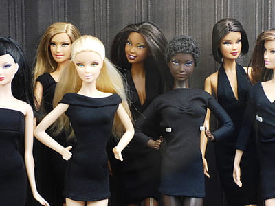 photography of dolls in black dresses thumbnail