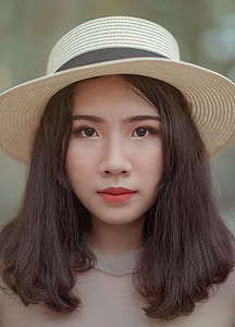 Woman Wearing Brown Bucket Cap thumbnail