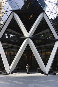 man standing below on St. Mary Axe building thumbnail