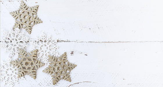 three gold-colored glitter ornament on white board thumbnail