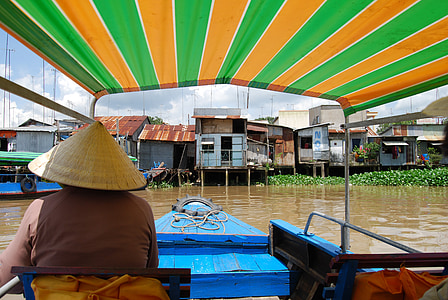 man riding blue boat during daytime thumbnail