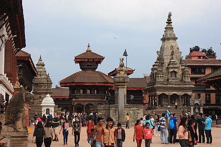 group of people walking between temples thumbnail