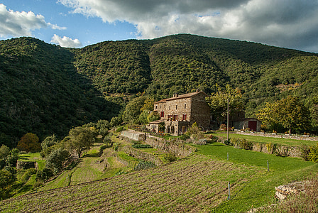 house near mountain thumbnail