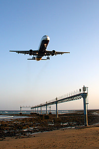 gray steel bridge on top of airplane during daytime thumbnail