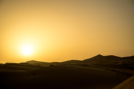 brown sands under yellow and gray sky photography during daytime thumbnail