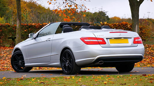 parked silver convertible thumbnail