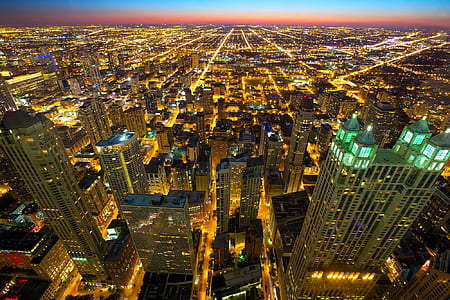 concrete city buildings at night time thumbnail