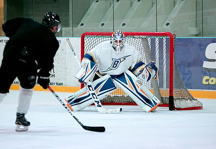 two ice hockey players on field thumbnail
