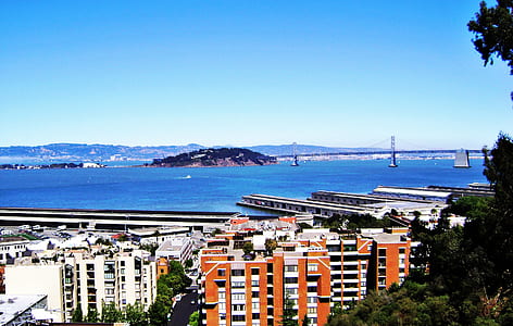 aerial shot of buildings and body of water thumbnail