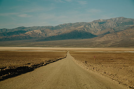 straight road with background of mountain thumbnail