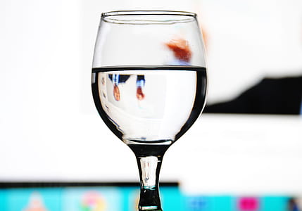 clear glass footed cup filled with water thumbnail