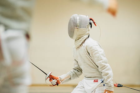 person playing fencing inside room thumbnail