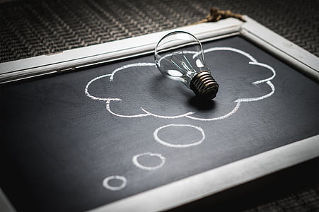 clear light bulb on black chalk board thumbnail