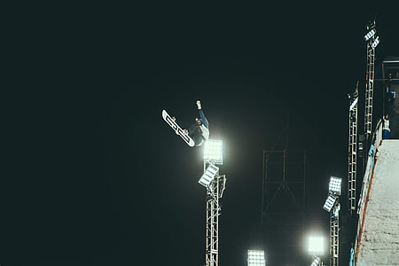 macro photography of man snowboarding thumbnail