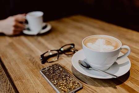 Cup of coffee on table in cafe thumbnail