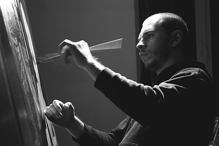 grey scale photo of man painting thumbnail