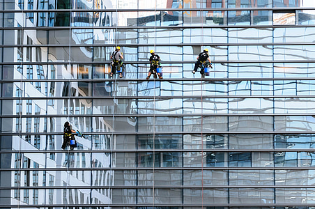 four people cleaning glass walls thumbnail