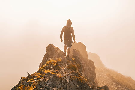 man on top of mountain thumbnail