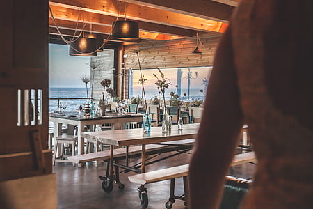 person standing near dining table thumbnail