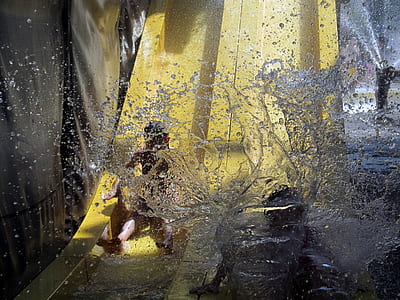 two toddler's sliding on body of water thumbnail