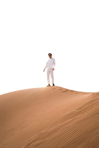 person standing on desert dune mountain thumbnail