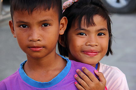 girl behind holding boy's arm thumbnail