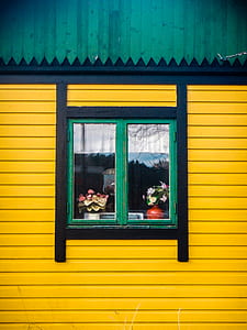 green and black window on yellow wall thumbnail