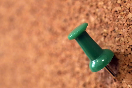 green paper pin on selective focus photo thumbnail