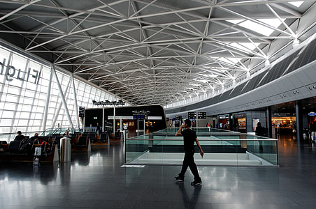 man walking inside airport thumbnail