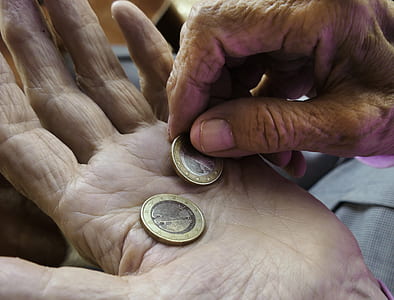 two round gold-and-silver-colored coins thumbnail
