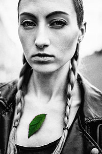 green leaf on woman in selective photo thumbnail