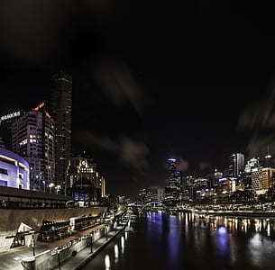 building view beside body of water thumbnail
