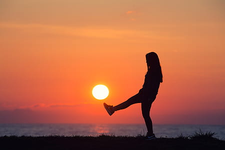 Silhouette Of Woman Raising Her Foot thumbnail