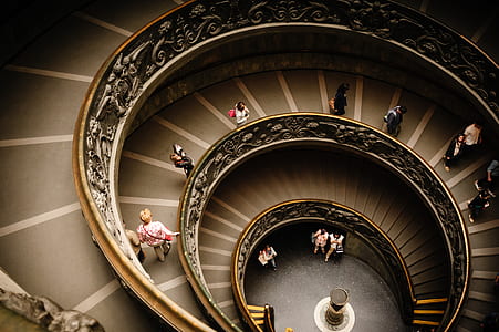 people walking on spiral stair thumbnail