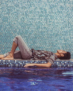 Man Lying Down on Pool Side thumbnail