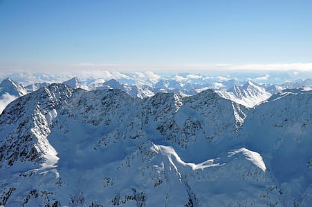 snow-covered mountain under blue sky thumbnail