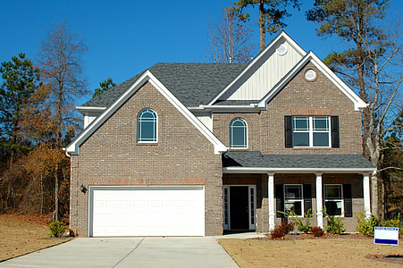 closed brown and white brick house thumbnail