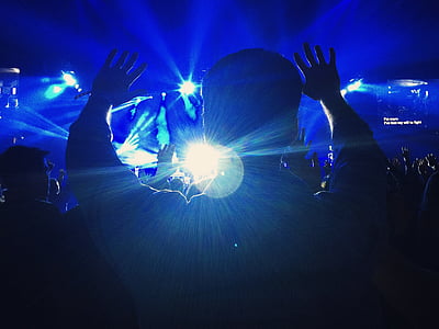 people raising hands inside building thumbnail